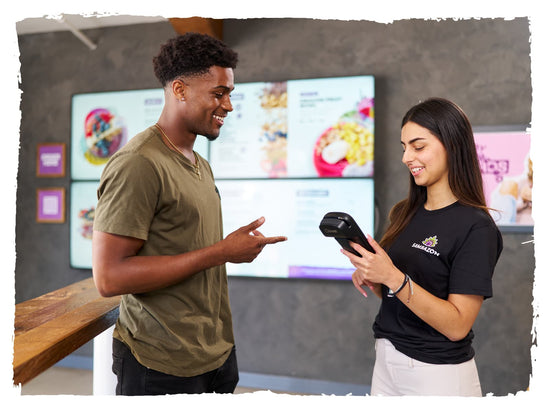 Customer ordering from a SAMBASSADOR through a hand held kiosk